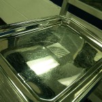 A silver tray featuring the Continental Airlines logo. On the bright side, the merged airline won't need to get new trays.